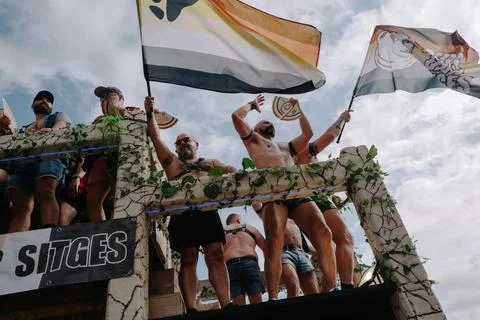 Pride float with cheering participants at Sitges Pride Parade, Spain Stock Photos