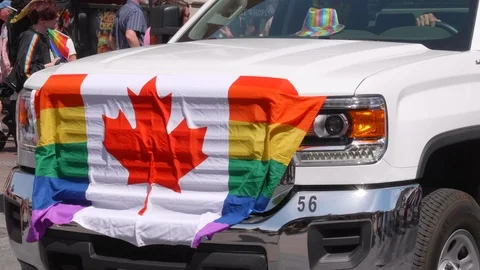 Pride Gay Maple Leaf Rainbow Canadian Flag on Parade Float Truck Vehicle Dowtown Stock Footage 97368218