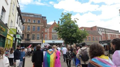 In the Pride march through Cambridge City Centre Square Stock Footage 338017630
