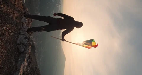 Pride month LGBTQ. Man standing with rainbow LGBT flag Stock Footage 247403471