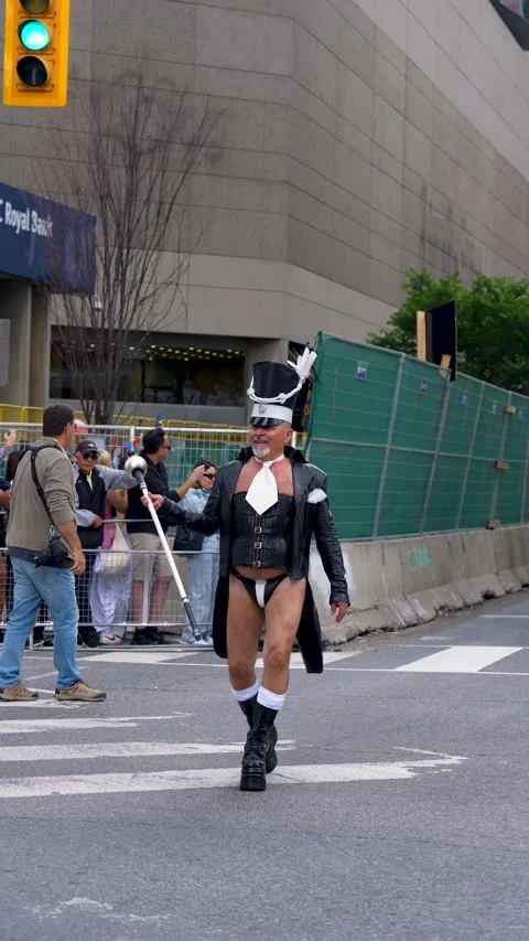 Pride Parade Participant in Bold Costume Walking in Toronto Video stock 332018064