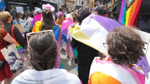Pride Parade walking past the pride buses and kings college chapel Stock Footage 338020015