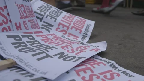 PRIDE IS A PROTEST - PRIDE NOT PROFIT PLACARDS AT PRIDE IN LONDON PARADE Stock Footage 130742874