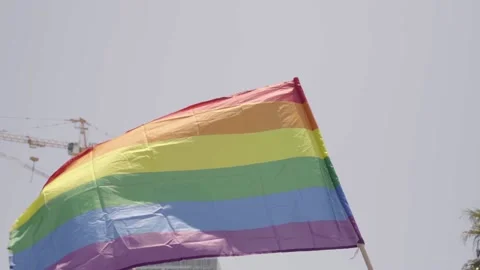 Pride Rainbow Flag waving in wind. Low angle shot of LGBT colorful awareness Video stock 144926747