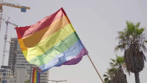 Pride Rainbow Flag waving in wind. Low angle shot of LGBT colorful awareness Video stock 144927012