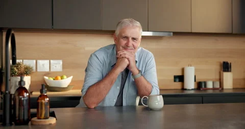 Pride, smile and face of old man in kitchen with retirement, optimism and Stock Footage 336857789