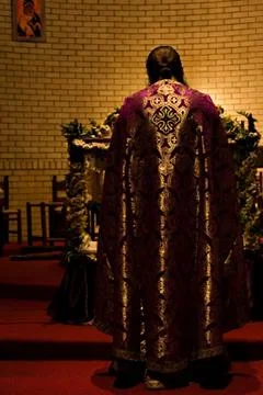 Priest in the altar Stock Photos