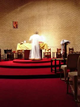 Priest on the altar Stock Photos