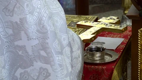 Priest baptizing wine in the temple before the wedding ceremony Stock Footage 282779480