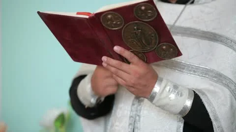 Priest with Bible in hands Stock Footage