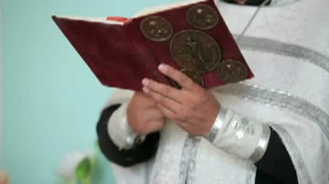 Priest with Bible in hands Stock Footage