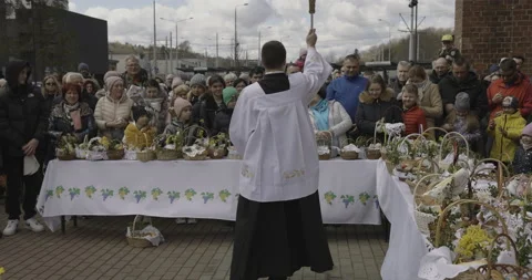 The priest blesses Easter food, 4K Stock Footage 183093593