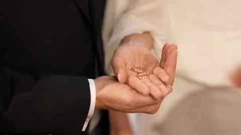 Priest Blesses Gold Wedding Rings in Bride and Groom Hands at Ceremony Stock Footage 343751005