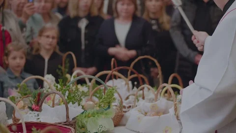 Priest consecrating Easter baskets, Poland Stock Footage 106673460