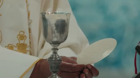 Priest Elevating The Chalice And Host During Catholic Mass Stock Footage 340595639