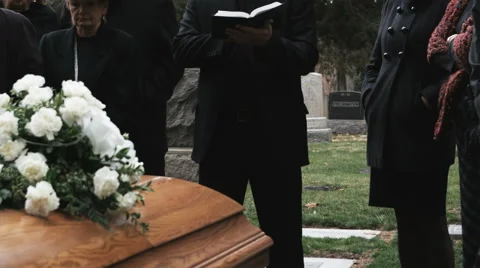 Priest giving a eulogy at a funeral Stock Footage 43094541
