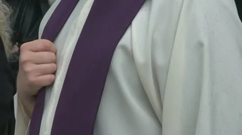 Priest hand close to heard Stock Footage 10892405
