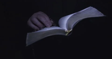 Priest holding a bible.  Vídeo Stock 55013816
