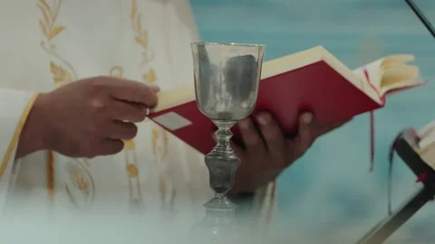 Priest Holding Silver Chalice And Missal During Catholic Mass In Portugal Stock Footage 337913375