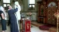 Priest with little baby in orthodox church (infant baptism, christening) HD Footage