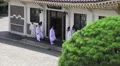 Priest Outside Shrine Building At The Chungnyeolsa Busan South Korea 4K 4k or 4k+ Resolution