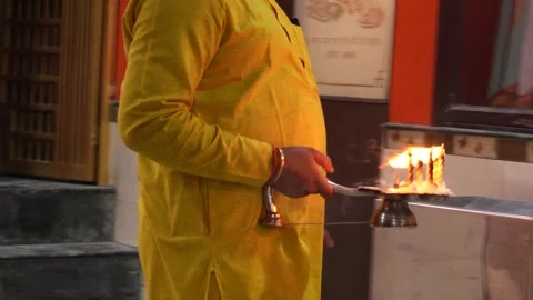 Priest Performing Evening Aarti in Temple with Diya Stock Footage 316895034