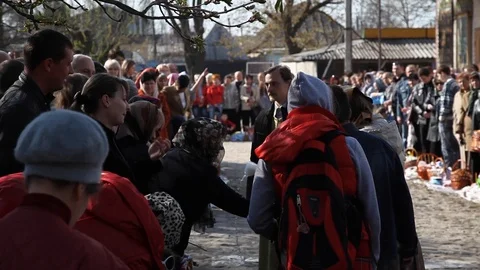 The priest pours holy water over the heads of people. celebrate holy easter. Stock Footage 123713273