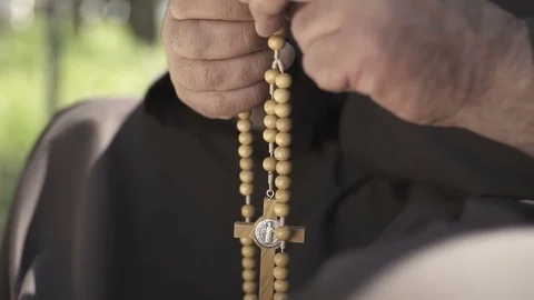 Priest praying hand close up with cross in hand Stock Footage 71288871