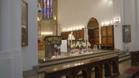 Priest is praying over bread and wine. Stock Footage 132246333