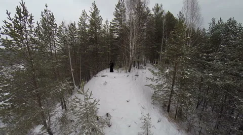 The priest praying in the winter on the hillside Stockbeeldmateriaal 59339751