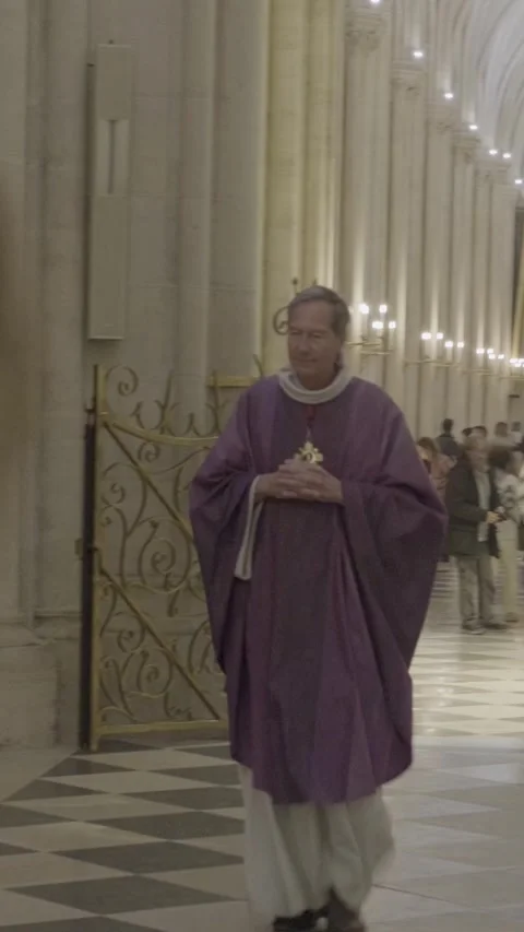 Priest in Purple Robe Waves Inside Notre Dame Cathedral Stock Footage 318589696