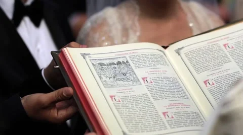 Priest read from the Scriptures during a religious weddings held in the small Stock Footage 60055718