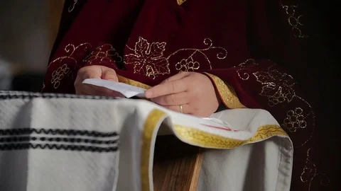Priest reading from a draft when preaching slow motion Stockbeeldmateriaal 84306266