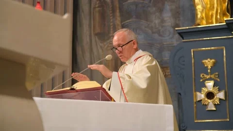 Priest is reading the prayer in the Catholic church. Stock Footage 132242753