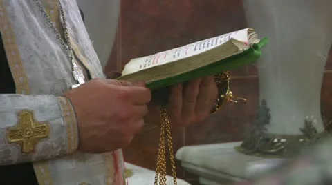 Priest reads a prayer and is baptized Vídeos de archivo 12279288
