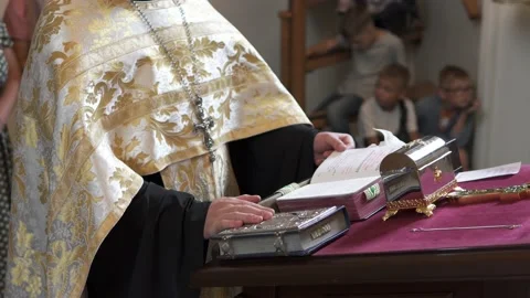 The priest reads prayers in the temple of God at the liturgy. Stock Footage 237299980
