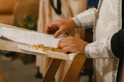 A Priest Reads Scriptures During a Christian Baptism Ceremony Stock Photos