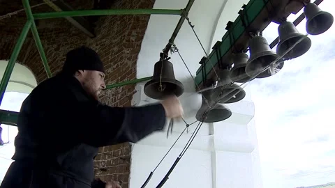 The priest rings the bells Stock Footage 132287618
