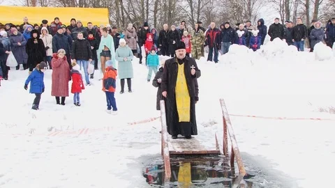 Priest sanctifies water Stock Footage 102424489