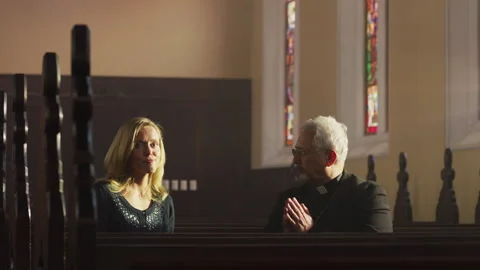 A priest talking to one of the people Stock Footage 262292647