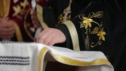 Priest turning a page in slow motion Stock Footage 84306191