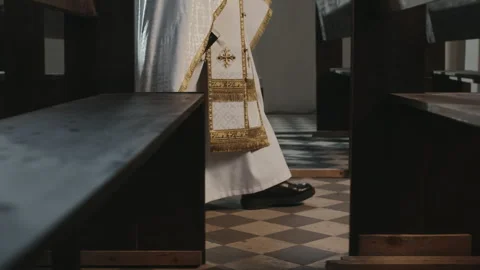 Priest in White Robe Walking among Pews in Church Vídeos de archivo 279826720