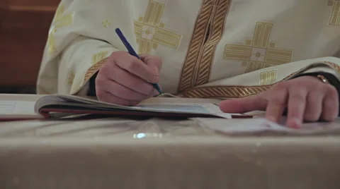 The Priest Wrote in a Notebook Stock Footage 61875449