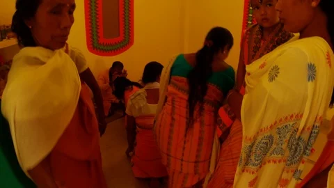 Priests bless Bodo Assam Local Tribe girls in the interior of the tribe temple i Stock Footage 113274339