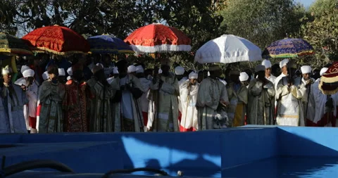 Priests in front of the pool during Timkat Amhara region, Lalibela, Ethiopia Stock Footage 210228969