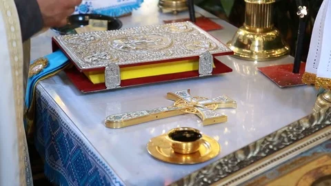 The priest's hand baptizes a cup of wine Stock Footage 99514704