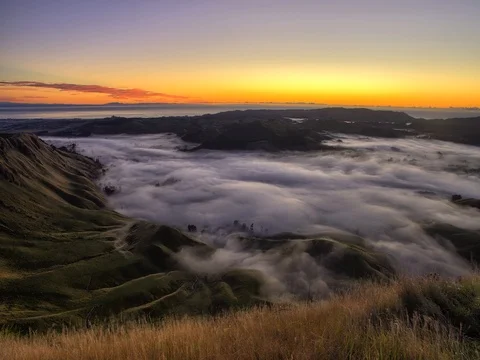 Primal Earth Images-4k-te-mata-sunrise-fog-bevan-percival Stock Footage 75790955