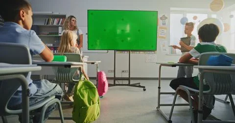 Primary School Boy Showcasing Knowledge Using Digital Screen with Chromakey Stock Photos