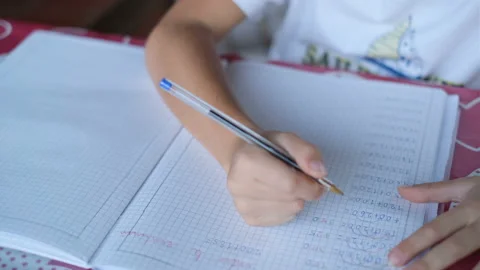 Primary school child boy while doing maths homework at home,education lifestyle Stock Footage 162214254