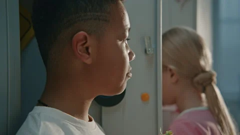 Primary School Child Eating Lunch During Recess in Modern Educational Stock Footage 342024256